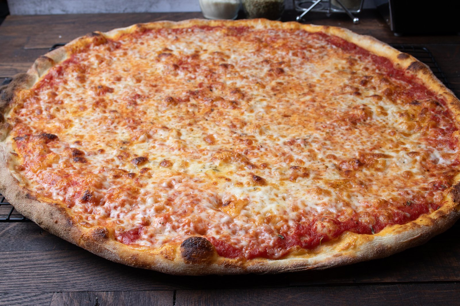 Slice showing tomato sauce under cheese