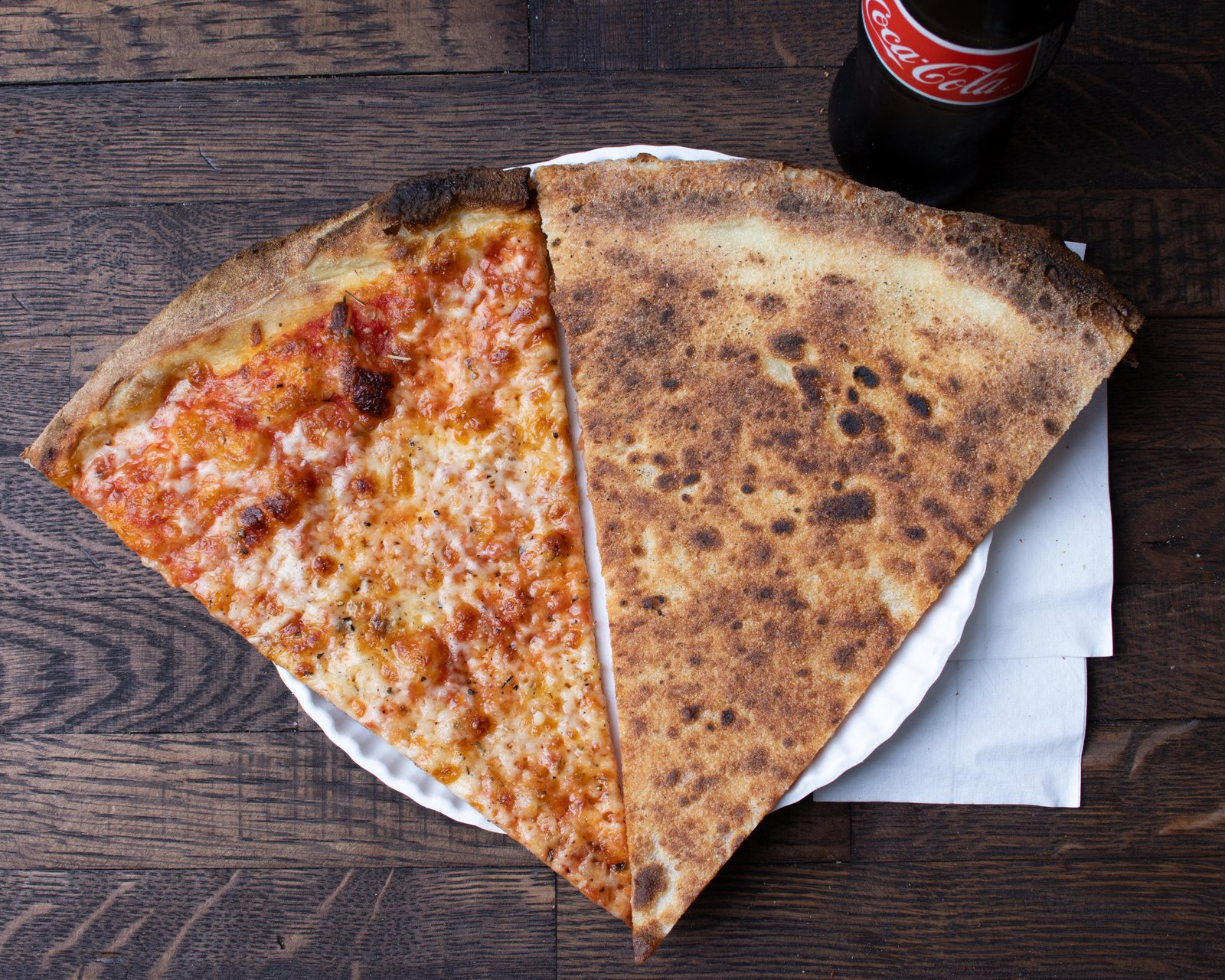 Sliced 20-inch NY-style pizza on tray